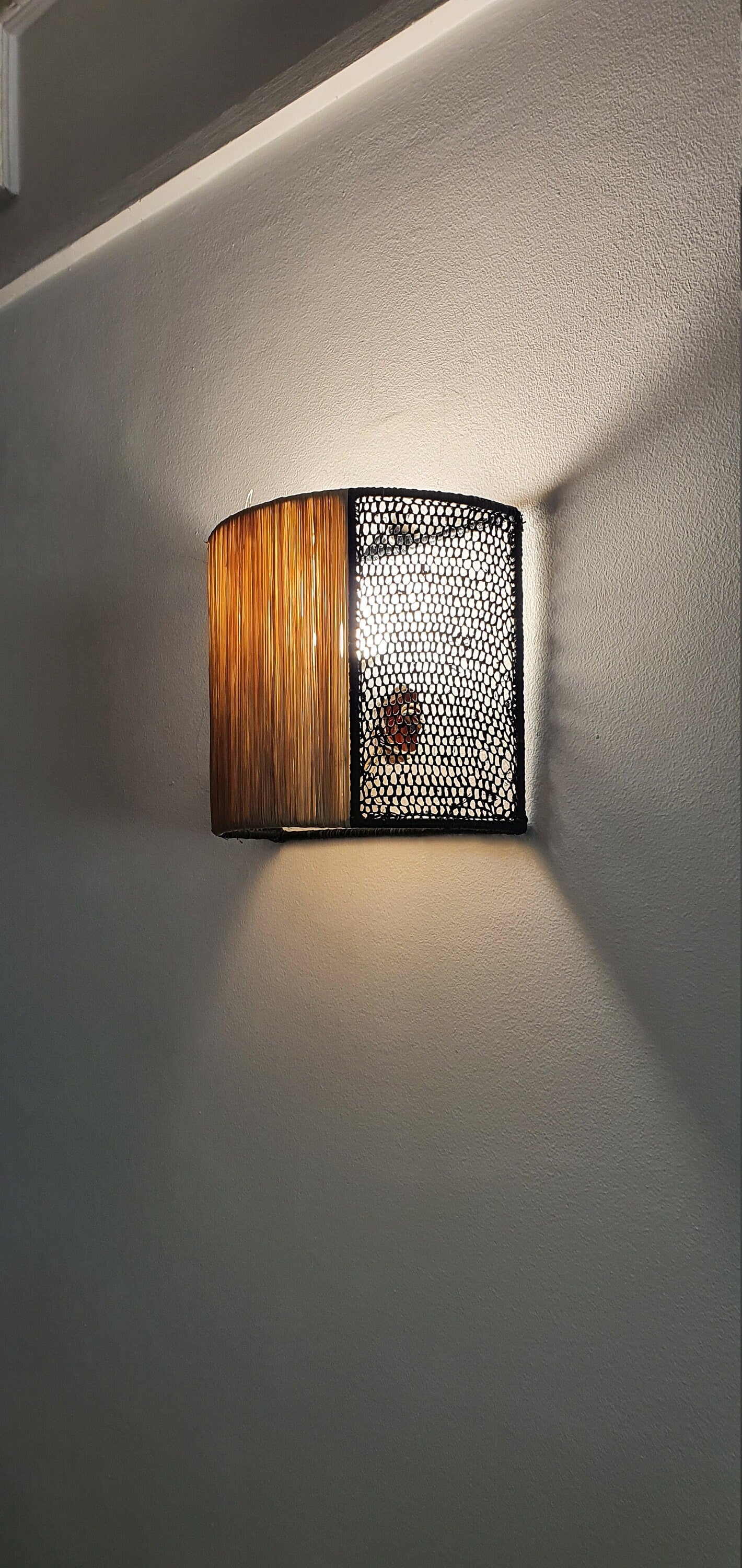 Stylish wall sconces with raffia appliques