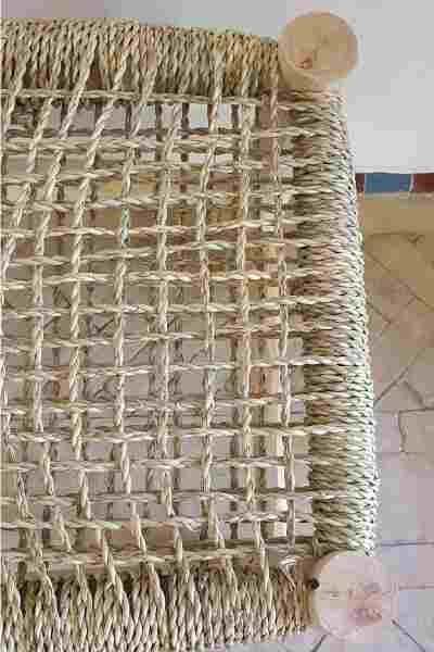 Rustic charm meets durability: wooden bench with natural weaving for indoor and outdoor use